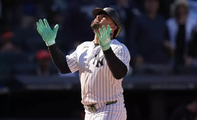 New York Yankees' Jasson Domínguez reacts after hitting a two-run home run during the eighth inning of a baseball game against the Baltimore Orioles, Sunday, May 3, 2026, in New York. (AP Photo/Seth Wenig)