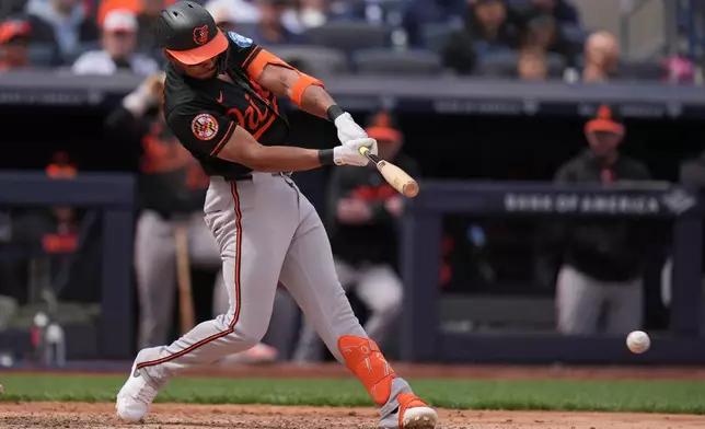 Baltimore Orioles' Jeremiah Jackson hits into a double play but still scores a run during the fourth inning of a baseball game against the New York Yankees, Sunday, May 3, 2026, in New York. (AP Photo/Seth Wenig)