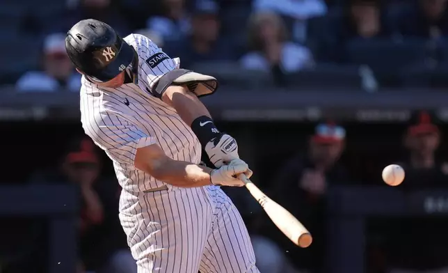 New York Yankees' Paul Goldschmidt hits a two-run single during the eighth inning of a baseball game against the Baltimore Orioles, Sunday, May 3, 2026, in New York. (AP Photo/Seth Wenig)