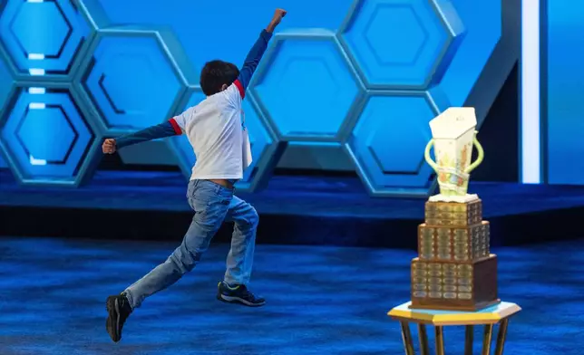 Sanil Thorat, 10, of Shreveport, La., reacts after answering correctly during the quarterfinals of the Scripps National Spelling Bee, Wednesday, May 27, 2026, in Washington. (AP Photo/Allison Robbert)