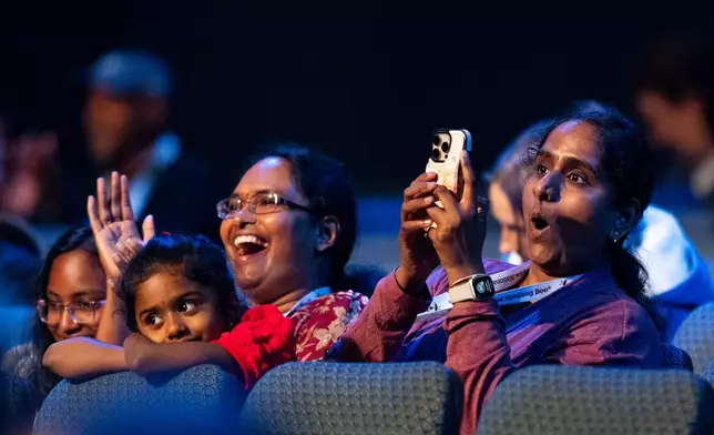 Parents in the audience watch closely during the quarterfinals of the Scripps National Spelling Bee, Wednesday, May 27, 2026, in Washington. (AP Photo/Allison Robbert)