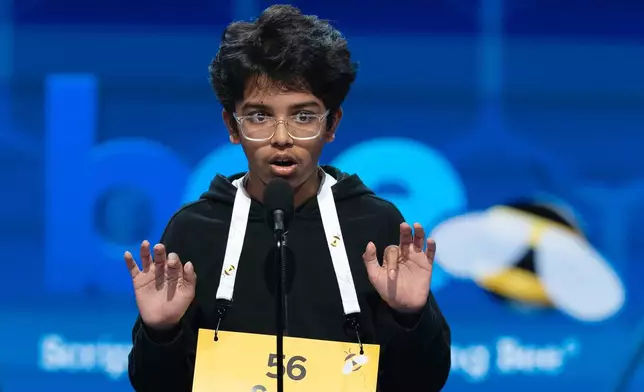 Sarv Dharavane, 12, Dunwoody, Ga., spells his word during the quarterfinals of the Scripps National Spelling Bee at DAR Constitution Hall, Wednesday, May 27, 2026, in Washington. (AP Photo/Jose Luis Magana)