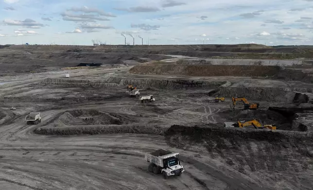 FILE - A mining truck operates in the Huaneng Yimin open-pit coal mine in Hulunbuir in northern China's Inner Mongolia province China, Sept. 15, 2025. (AP Photo/Ng Han Guan, File)