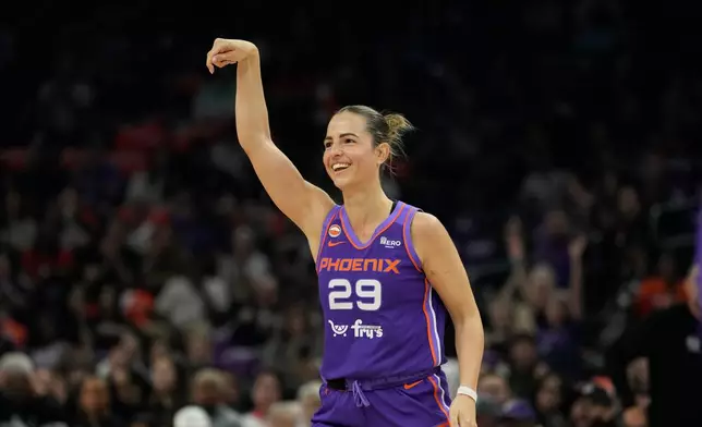 Phoenix Mercury guard Jovana Nogic smiles as she celebrates a 3-pointer against the Chicago Sky during the first half of a WNBA basketball game, Friday, May 15, 2026, in Phoenix. (AP Photo/Ross D. Franklin)