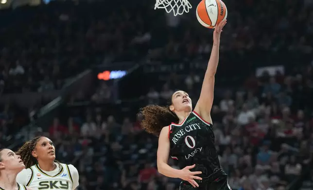 Portland Fire guard Carla Leite (0) goes to the basket during the first half of a WNBA basketball game against the Chicago Sky on Saturday, May 9, 2026, in Portland, Ore. (AP Photo/Jenny Kane)