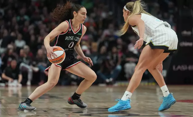 Portland Fire guard Carla Leite (0) looks to go to the basket during the first half of a WNBA basketball game against the Chicago Sky on Saturday, May 9, 2026, in Portland, Ore. (AP Photo/Jenny Kane)
