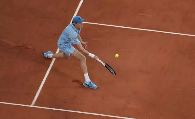 Jannik Sinner of Italy returns to Clement Tabur of France during their first round men's singles tennis match at the French Open tennis tournament in Paris, Tuesday, May 26, 2026. (AP Photo/Thibault Camus)