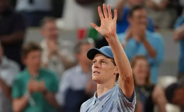Jannik Sinner of Italy celebrates after winning the first round men's singles tennis match against Clement Tabur of France at the French Open tennis tournament in Paris, Tuesday, May 26, 2026. (AP Photo/Thibault Camus)