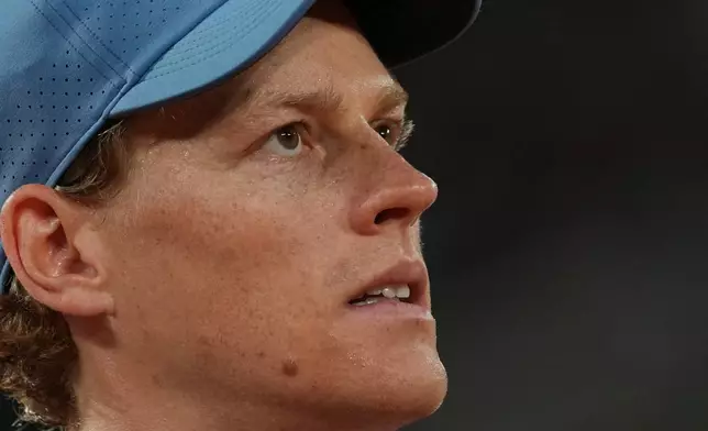 Jannik Sinner of Italy reacts as he plays against Clement Tabur of France during their first round men's singles tennis match at the French Open tennis tournament in Paris, Tuesday, May 26, 2026. (AP Photo/Thibault Camus)