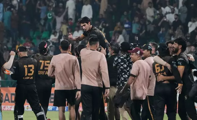 Hyderabad Kingsmen Hunain Shah, top center, celebrates with teammates after their team won the Pakistan Super League second eliminator cricket match against Islamabad United, in Lahore, Pakistan, Friday, May 1, 2026. (AP Photo/K.M. Chaudary)
