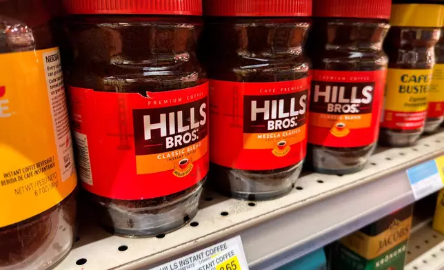 FILE - Coffee is displayed for sale at a grocery store Wednesday, April 29, 2026, in Chicago. (AP Photo/Erin Hooley, File)
