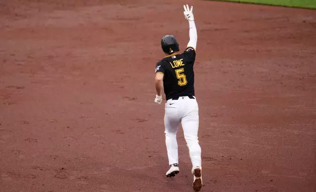 Pittsburgh Pirates' Brandon Lowe (5) rounds the bases after hitting a three-run home runb off Chicago Cubs pitcher Jameson Taillon (50) during the third inning of a baseball game in Pittsburgh, Wednesday, May 27, 2026. (AP Photo/Gene J. Puskar)