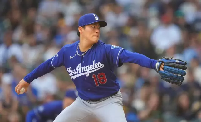 Los Angeles Dodgers pitcher Yoshinobu Yamamoto throws during the second inning of a baseball game against the Milwaukee Brewers, Sunday, May 24, 2026, in Milwaukee. (AP Photo/Kayla Wolf)