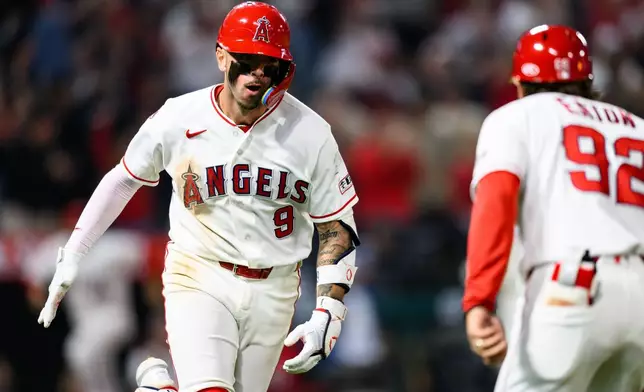 Los Angeles Angels' Zach Neto (9) reacts after hitting a walkoff home run during the ninth inning of a baseball game against the Athletics, Monday, May 18, 2026, in Anaheim, Calif. (AP Photo/William Liang)