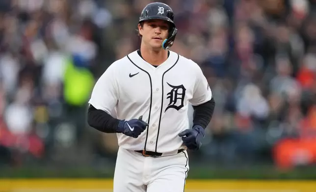 Detroit Tigers' Dillon Dingler runs the bases after hitting a three-run home run in the first inning of a baseball game against the Texas Rangers, Saturday, May 2, 2026, in Detroit. (AP Photo/Paul Sancya)