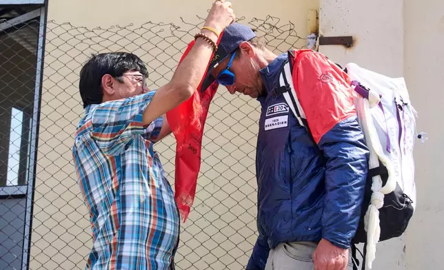 British mountain guide Kenton Cool, who scaled Mount Everest Sunday for the 20th time breaking his own record for the most ascents of the world's highest mountain by a non-Sherpa guide, arrives at the airport in Kathmandu, Nepal, Sunday, May 24, 2026. (AP Photo/Niranjan Shrestha)