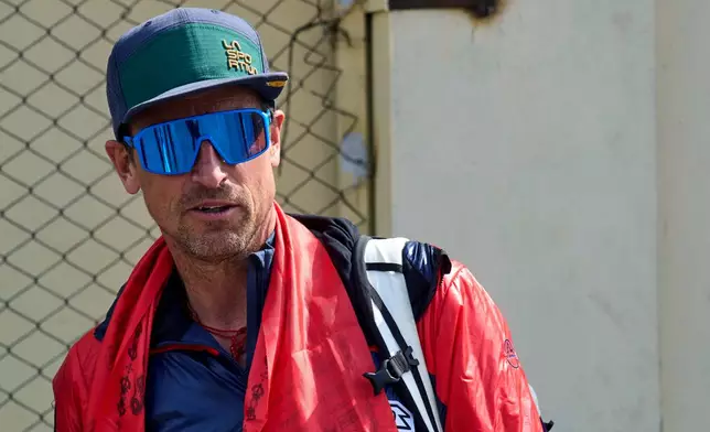 British mountain guide Kenton Cool, who scaled Mount Everest Sunday for the 20th time breaking his own record for the most ascents of the world's highest mountain by a non-Sherpa guide, arrives at the airport in Kathmandu, Nepal, Sunday, May 24, 2026. (AP Photo/Niranjan Shrestha)