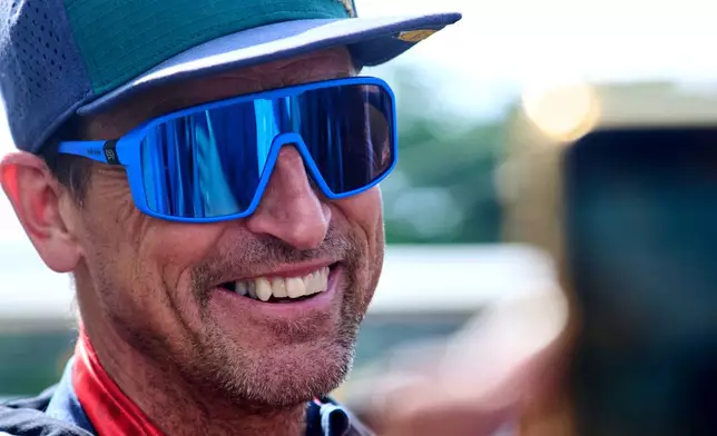 British mountain guide Kenton Cool, who scaled Mount Everest Sunday for the 20th time breaking his own record for the most ascents of the world's highest mountain by a non-Sherpa guide, arrives at the airport in Kathmandu, Nepal, Sunday, May 24, 2026. (AP Photo/Niranjan Shrestha)