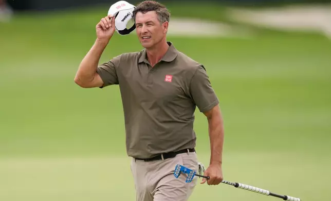 Adam Scott, of Australia, reacts on the 18th hole during the final round of the Cadillac Championship PGA golf tournament Sunday, May 3, 2026, in Doral, Fla. (AP Photo/David J. Phillip)