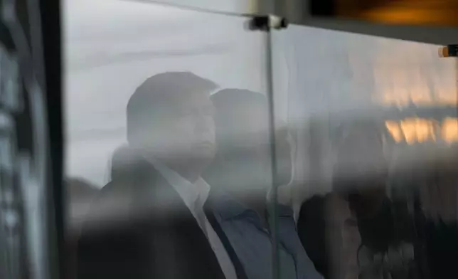 President Donald Trump watches play on the 18th hole during the final round of the Cadillac Championship PGA golf tournament Sunday, May 3, 2026, in Doral, Fla. (AP Photo/David J. Phillip)
