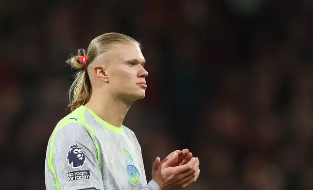 Manchester City's Erling Haaland applauds supporters after the English Premier League soccer match between AFC Bournemouth and Manchester City in Bournemouth, England, Tuesday, May 19, 2026. (AP Photo/Ian Walton)