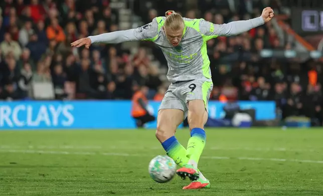 Manchester City's Erling Haaland scores his side's opening goal during the English Premier League soccer match between AFC Bournemouth and Manchester City in Bournemouth, England, Tuesday, May 19, 2026. (AP Photo/Ian Walton)