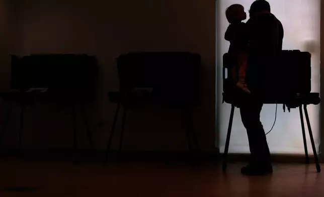 Voters cast their ballots at vote centers during a primary election on Tuesday, May 5, 2026, in West Lafayette, Ind. (AP Photo/Cara Penquite)