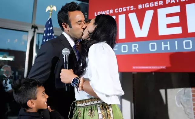 Republican Ohio gubernatorial candidate Vivek Ramaswamy kisses his wife Apoorva Ramaswamy during a watch party at the Spruce St. Sporting sports bar after winning the party?s nomination for governor Tuesday, May 5, 2026, in Columbus. (AP Photo/Carolyn Kaster)