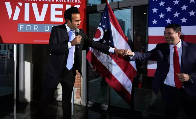 Republican Ohio gubernatorial candidate Vivek Ramaswamy, left, fist-bumps state Senate President Rob McColley during a watch party at the Spruce St. Sporting sports bar after winning the party?s nomination for governor Tuesday, May 5, 2026, in Columbus. (AP Photo/Carolyn Kaster)