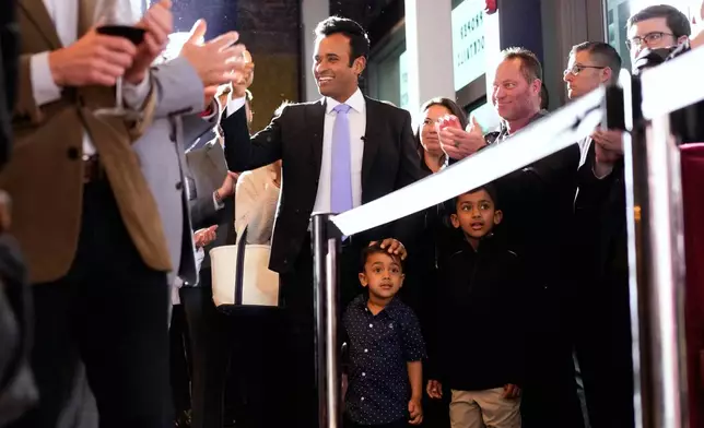 Republican Ohio gubernatorial candidate Vivek, alongside sons Karthik and Arjun, greets supporters during a watch party at the Spruce St. Sporting sports bar after winning the party's nomination for governor Tuesday, May 5, 2026, in Columbus. (AP Photo/Carolyn Kaster)