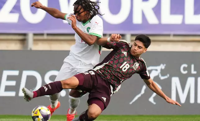 FILE - Mexico's Obed Vargas, right, and Morocco's Mohamed Hamony battle for the ball during a FIFA U-20 World Cup Group C soccer match at Elias Figueroa Brander Stadium in Valparaiso, Chile, Saturday, Oct. 4, 2025. (AP Photo/Andre Penner, File)