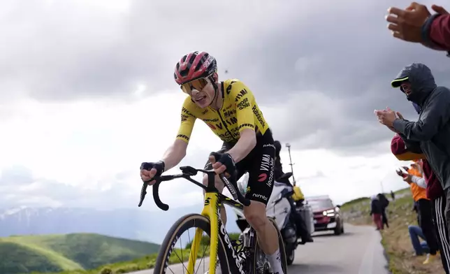 Denmark's Jonas Vingegaard is cheered by fans as he pedals on his way to win the 7th stage of the Giro d'Italia cycling race, from Formia to Blockhaus, Italy, Friday May 15, 2026. (Fabio Ferrari/LaPresse via AP)