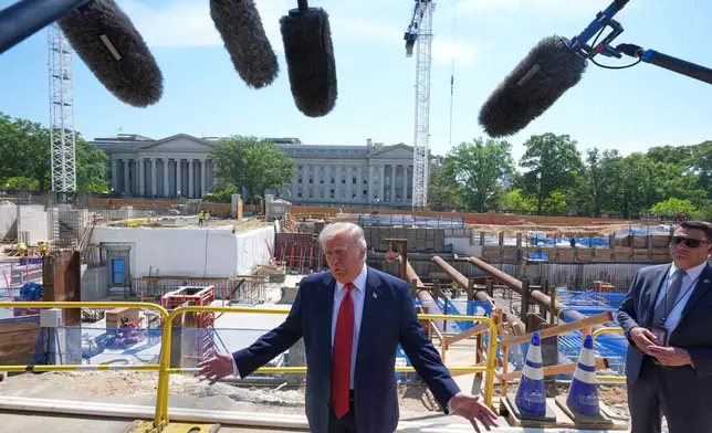 President Donald Trump tours Ballroom construction around the outside the White House, Tuesday, May 19, 2026, in Washington. (AP Photo/Jacquelyn Martin)