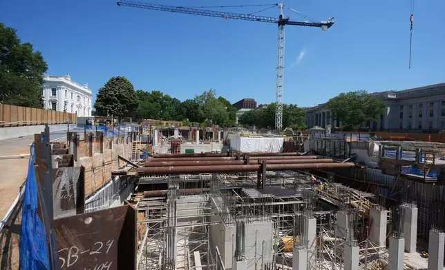 The Ballroom construction site can be seen as President Donald Trump tours the area at the White House, Tuesday, May 19, 2026, in Washington. (AP Photo/Jacquelyn Martin)