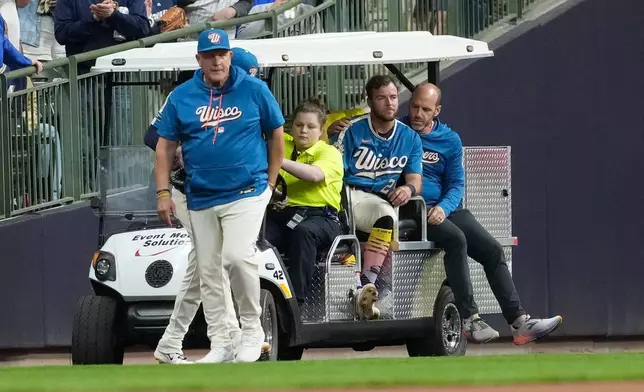Milwaukee Brewers' Brandon Lockridge is carted off the field after suffering an injury during the fourth inning of a baseball game against the New York Yankees, Friday, May 8, 2026, in Milwaukee. (AP Photo/Aaron Gash)