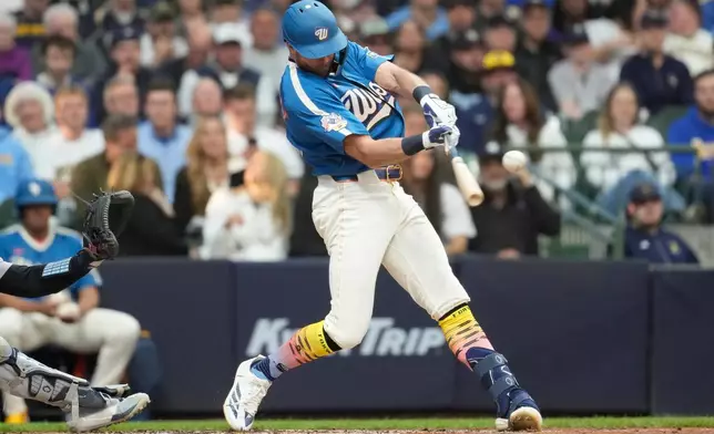 Milwaukee Brewers' Brandon Lockridge hits an RBI single during the second inning of a baseball game against the New York Yankees, Friday, May 8, 2026, in Milwaukee. (AP Photo/Aaron Gash)