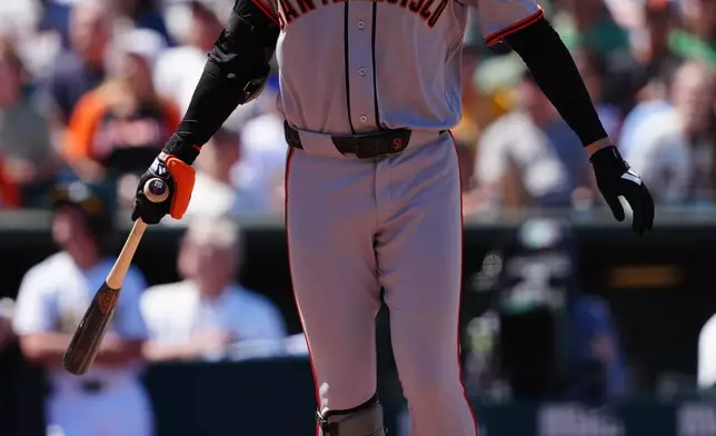 San Francisco Giants' Jung Hoo Lee reacts after missing a pitch in the seventh inning of a baseball game against the Athletics, Sunday, May 17, 2026, in West Sacramento, Calif. (AP Photo/Alan Greth)