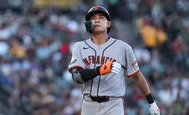 San Francisco Giants' Jung Hoo Lee walks to the dugout after hitting a line out during the first inning of a baseball game against the Athletics, Saturday, May 16, 2026, in West Sacramento, Calif. (AP Photo/Sara Nevis)