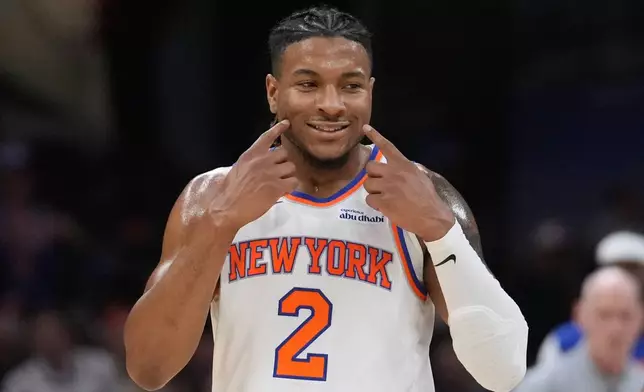 New York Knicks guard Miles McBride reacts during the second half of Game 4 in the Eastern Conference finals NBA basketball playoffs series against the Cleveland Cavaliers in Cleveland, Monday, May 25, 2026. (AP Photo/Sue Ogrocki)
