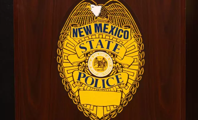 FILE - A New Mexico State Police emblem is displayed on podium during a news conference, March 16, 2024, in Albuquerque, N.M. (Jon Austria/The Albuquerque Journal via AP, File)