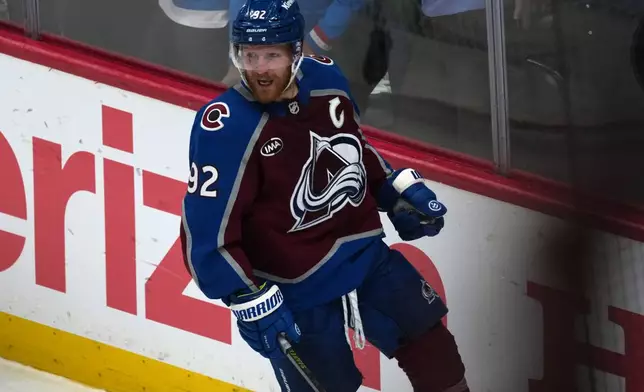 Colorado Avalanche left wing Gabriel Landeskog reacts after scoring a goal against the Vegas Golden Knights during the third period in Game 1 of the Western Conference finals NHL hockey Stanley Cup playoff series Wednesday, May 20, 2026, in Denver. (AP Photo/David Zalubowski)