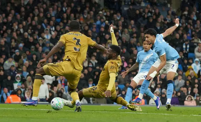Manchester City's Omar Marmoush, right, scores his side's second goal during the English Premier League soccer match between Manchester City and Crystal Palace in Manchester, England, Wednesday, May 13, 2026. (AP Photo/Ian Hodgson)