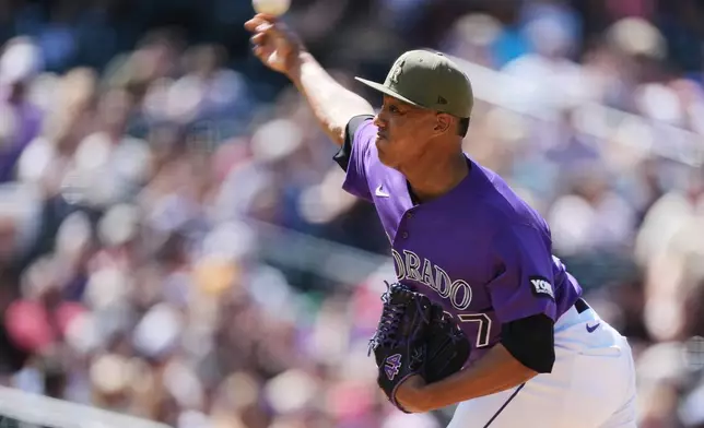 Colorado Rockies relief pitcher Juan Mejia works against the Arizona Diamondbacks in the seventh inning of a baseball game Saturday, May 16, 2026, in Denver. (AP Photo/David Zalubowski)