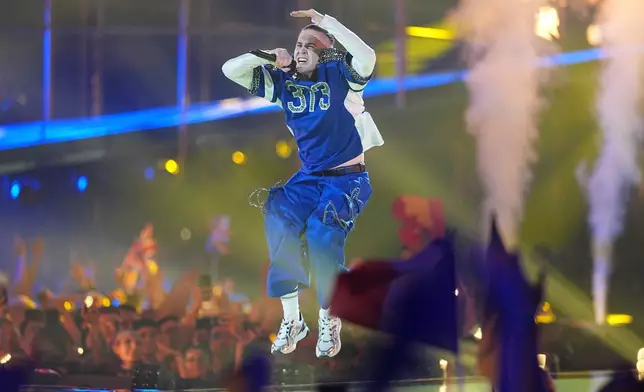 Satoshi from Moldova performs the song "Viva, Moldova!" during the Grand Final of the 70th Eurovision Song Contest in Vienna, Austria, Saturday, May 16, 2026. (AP Photo/Martin Meissner)