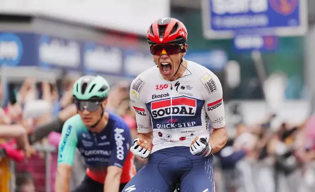 France's Paul Magnier celebrates winning stage 1 of the Giro d'Italia cycling race, from Nessebar to Burgas, Bulgaria, Friday, May 8, 2026. (Massimo Paolone/LaPresse via AP)
