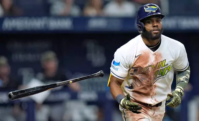 Tampa Bay Rays' Cedric Mullins drops his bat after hitting a home run off Miami Marlins pitcher Janson Junk during the sixth inning of a baseball game Friday, May 15, 2026, in St. Petersburg, Fla. (AP Photo/Chris O'Meara)