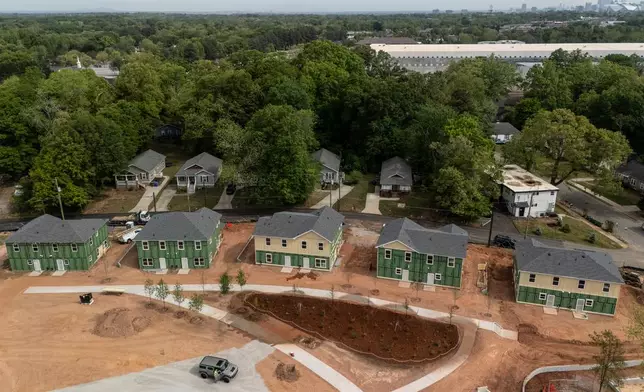 New homes under construction are seen in Langston Park, April 13, 2026, in Atlanta. (AP Photo/Mike Stewart)