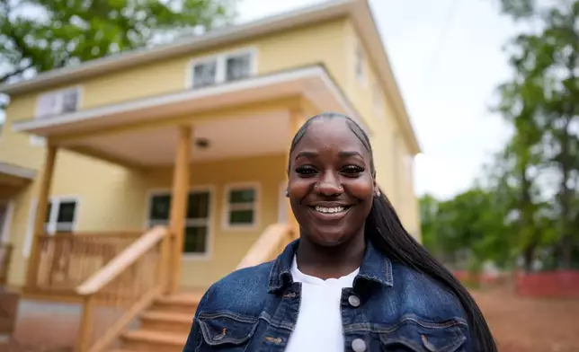 Home owner Phileena Daniel poses for a photo in Langston Park, April 13, 2026, in Atlanta. (AP Photo/Mike Stewart)