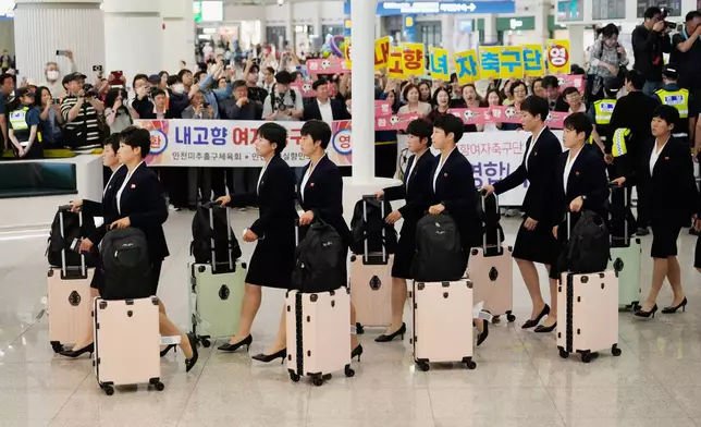 Members of North Korea's soccer club Naegohyang Women's FC team arrives at Incheon International Airpot in Incheon, South Korea, Sunday, May 17, 2026. (AP Photo/Ahn Young-joon)