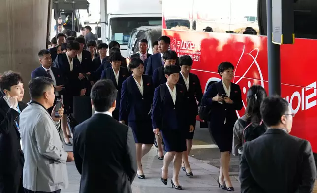 North Korean women's soccer players prepare to get into a bus after arriving for the semifinals of the AFC Women's Champions League at Incheon International Airpot in Incheon, South Korea Sunday, May 17, 2026. (AP Photo/Ahn Young-joon)